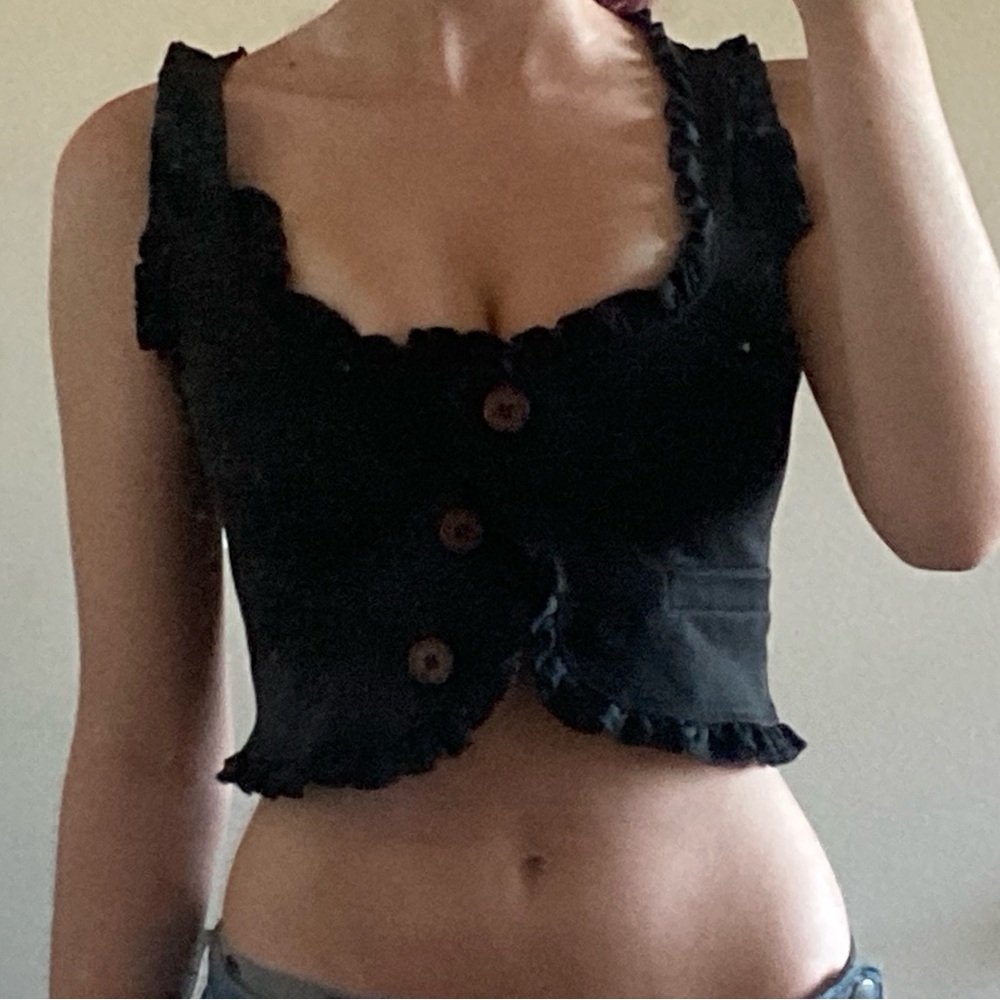 black ruffled waist coat